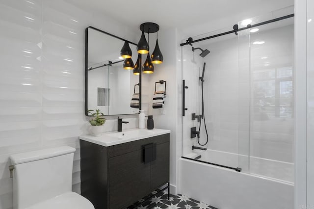 full bathroom featuring shower / bath combination with glass door, tile patterned flooring, vanity, and toilet