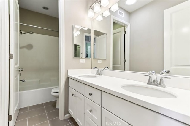 full bathroom featuring tile patterned flooring, vanity, toilet, and washtub / shower combination