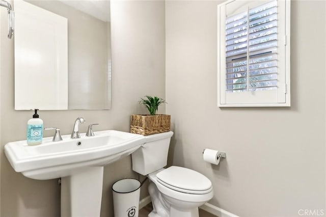 bathroom with toilet and sink