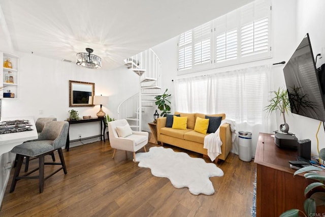 living room featuring dark hardwood / wood-style floors and a notable chandelier