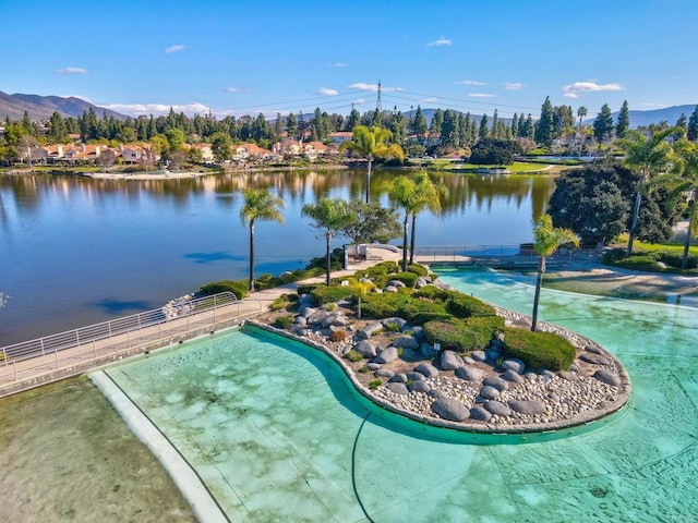 exterior space featuring a water and mountain view