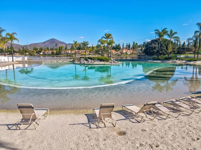 view of swimming pool featuring a mountain view