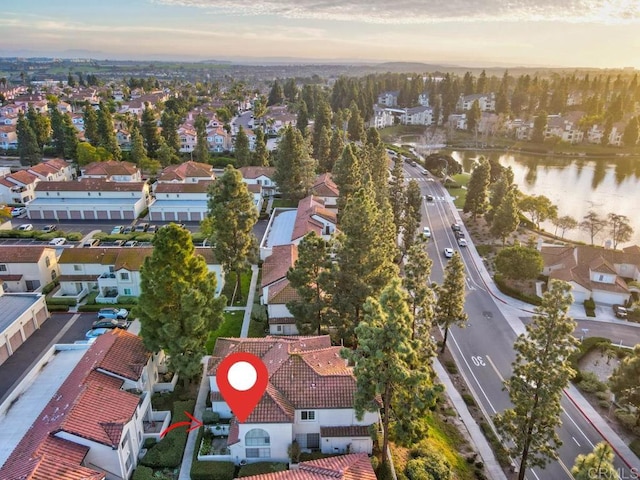 aerial view at dusk with a water view