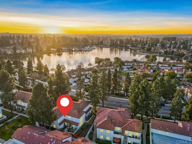 aerial view at dusk with a water view