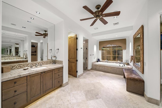 bathroom featuring shower with separate bathtub, vanity, and ceiling fan