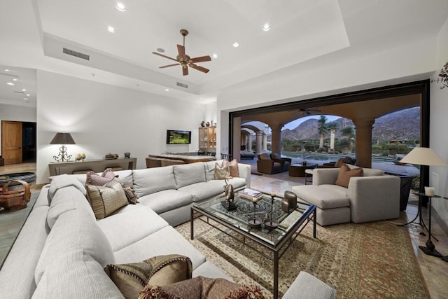 living room with a raised ceiling