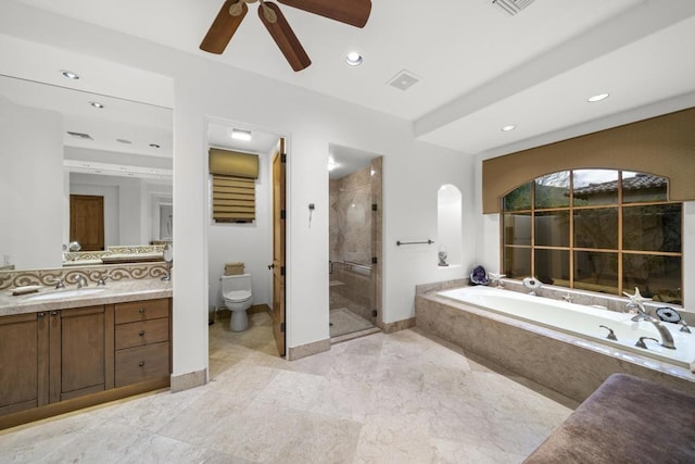 full bathroom featuring vanity, ceiling fan, toilet, and plus walk in shower