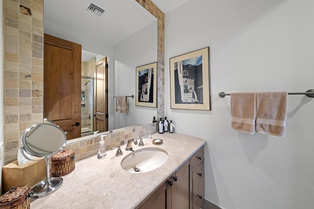 bathroom with tasteful backsplash, vanity, and shower / bathtub combination