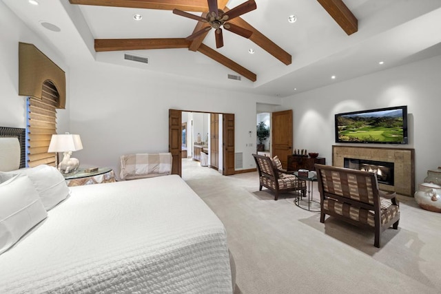 carpeted bedroom with vaulted ceiling with beams and ceiling fan