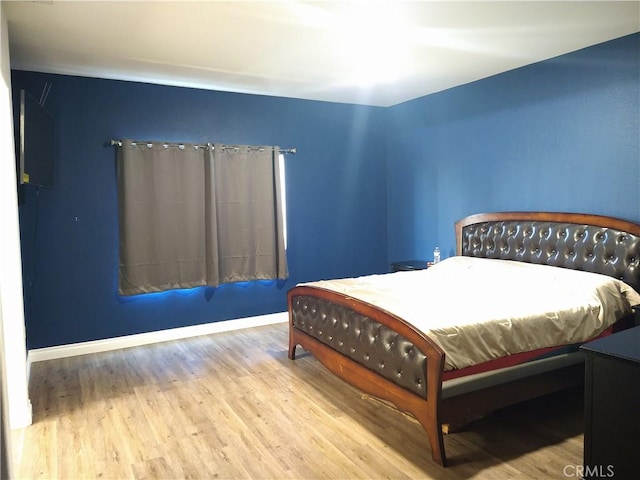 bedroom featuring hardwood / wood-style flooring