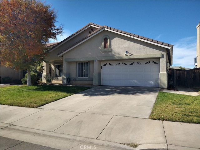 view of front facade featuring a garage and a front lawn