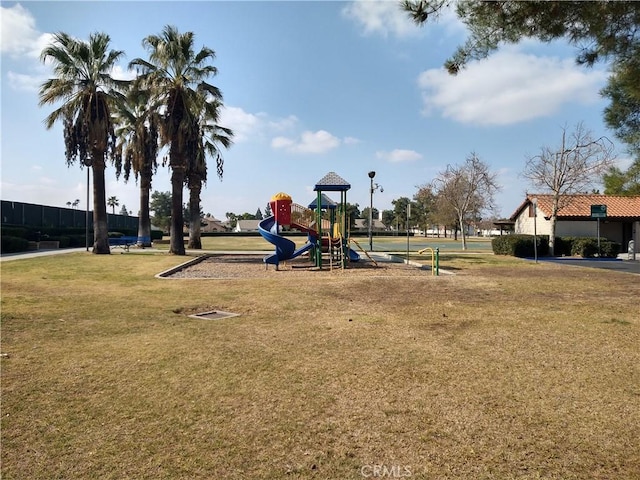 view of playground with a yard