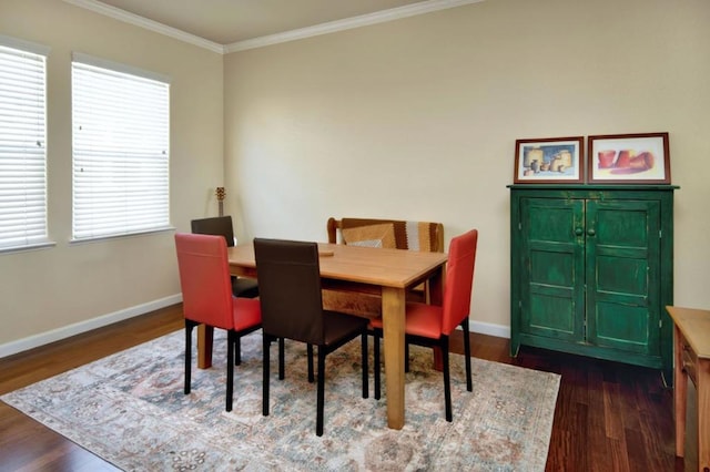 dining space with dark hardwood / wood-style floors and ornamental molding