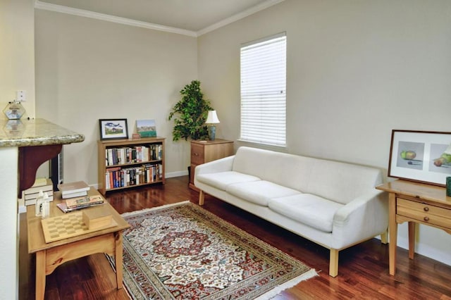 living area with dark hardwood / wood-style floors and crown molding