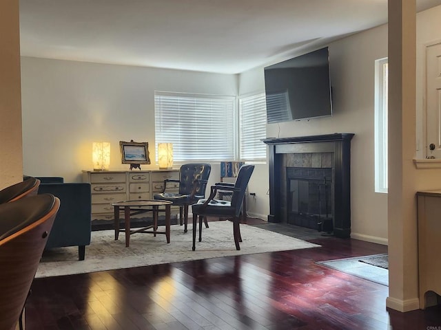 interior space featuring hardwood / wood-style floors and a tile fireplace