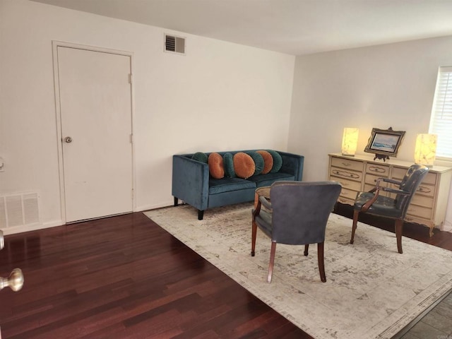 living area with hardwood / wood-style flooring