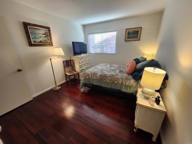 bedroom with dark wood-type flooring