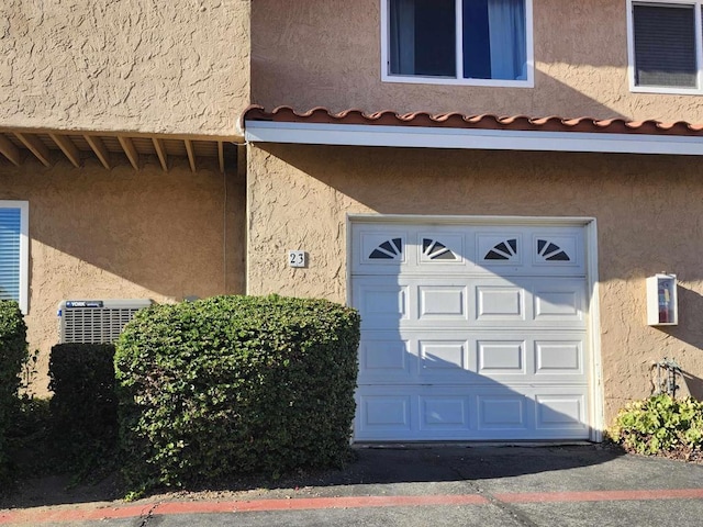 doorway to property featuring a garage