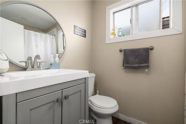 bathroom with vanity and toilet