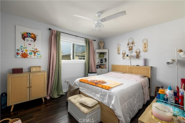 bedroom with dark hardwood / wood-style flooring and ceiling fan