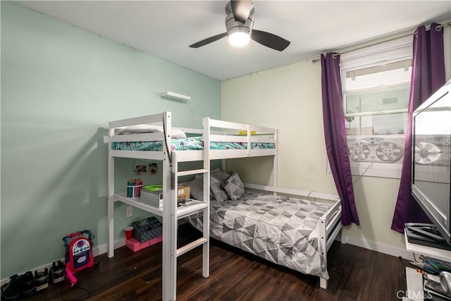 bedroom with ceiling fan and dark hardwood / wood-style flooring