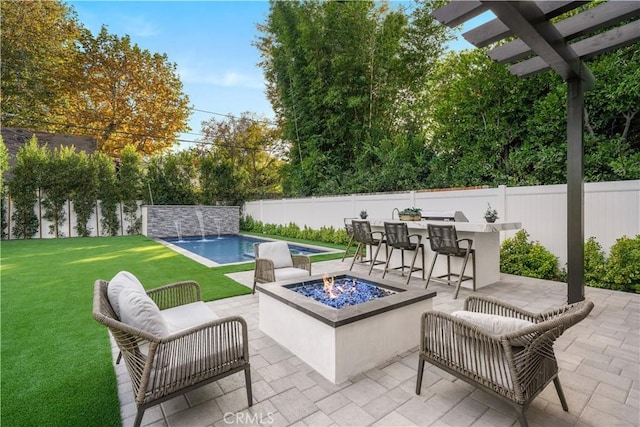 view of patio featuring pool water feature, a fenced in pool, and exterior bar