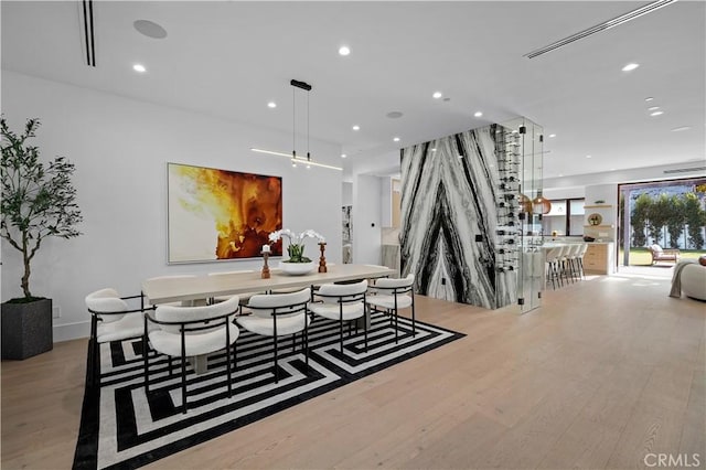 dining area featuring light wood-type flooring