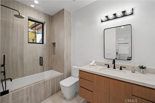 full bathroom featuring vanity, tiled shower / bath combo, tile patterned floors, and toilet