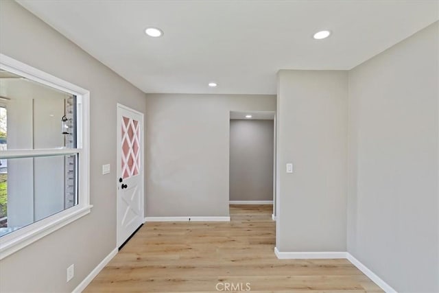 foyer entrance with light wood-type flooring