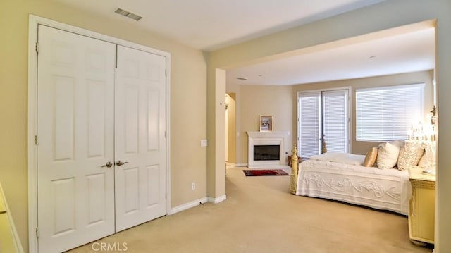 carpeted bedroom with a closet