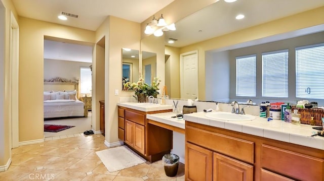 bathroom with vanity and tile patterned floors