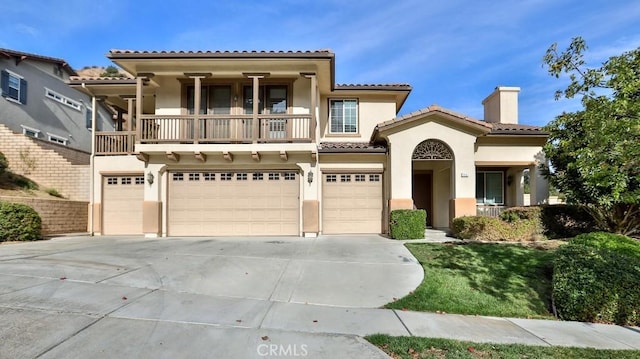 mediterranean / spanish house with a garage