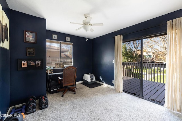 office area featuring carpet, ceiling fan, and a healthy amount of sunlight