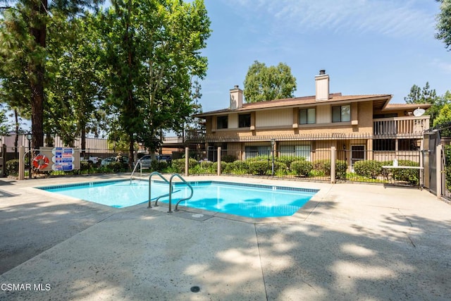 view of swimming pool featuring a patio