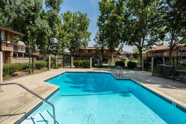 view of swimming pool with a patio area