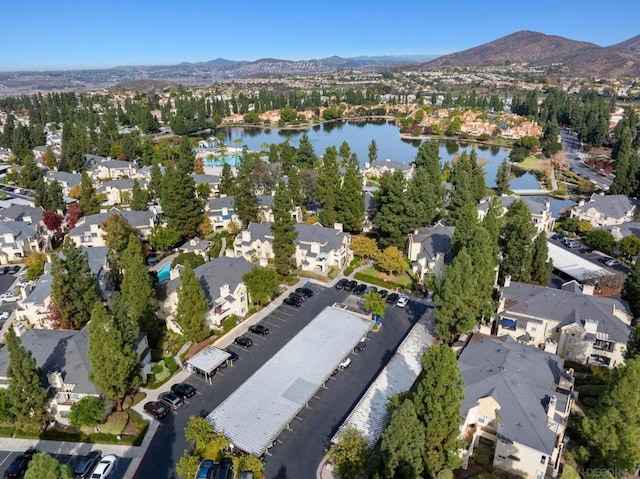 aerial view featuring a water and mountain view