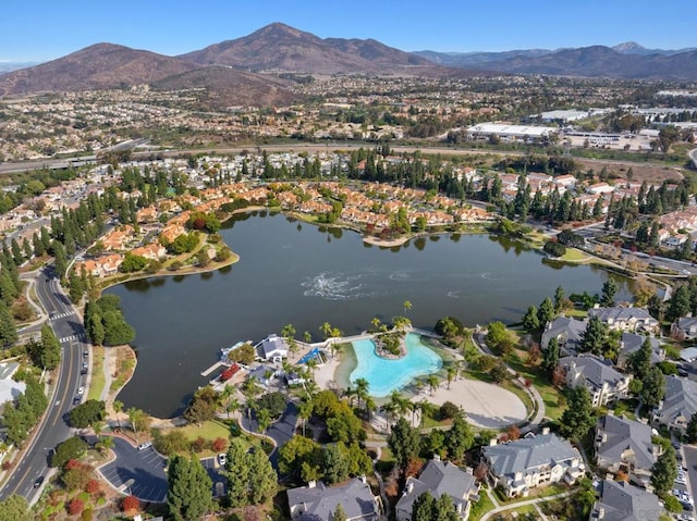 drone / aerial view with a water and mountain view