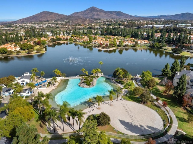 drone / aerial view featuring a water and mountain view