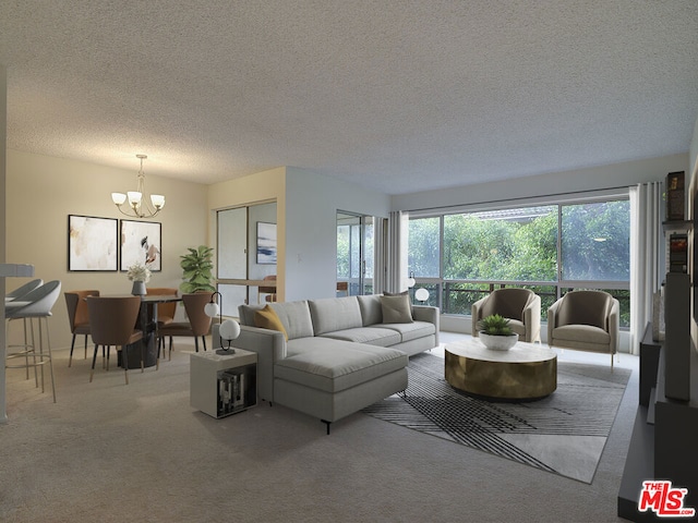 living room featuring carpet, a chandelier, and a textured ceiling