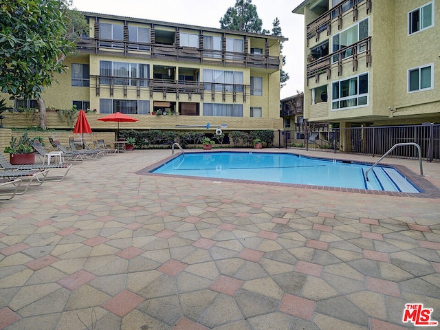 view of swimming pool with a patio area