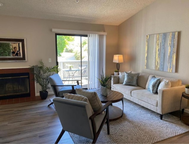 living room featuring hardwood / wood-style flooring and a textured ceiling