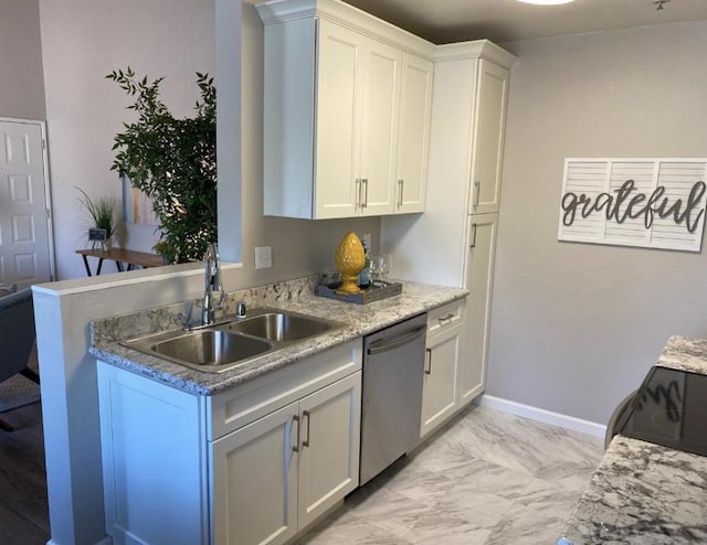 kitchen featuring sink, stainless steel dishwasher, white cabinets, light stone countertops, and stove