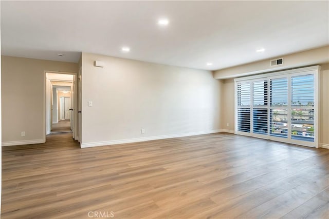 unfurnished room featuring light wood-type flooring