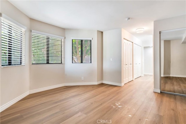 empty room with light wood-type flooring