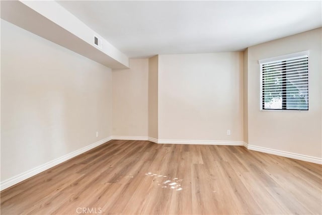 empty room with light wood-type flooring