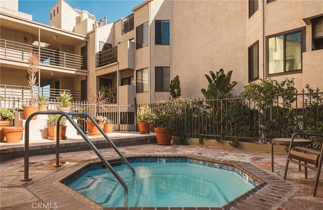 view of pool featuring a hot tub