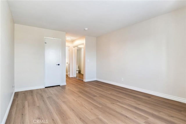 unfurnished room with light hardwood / wood-style floors