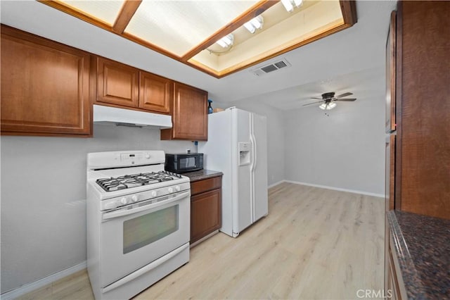 kitchen with white appliances, light hardwood / wood-style floors, and ceiling fan