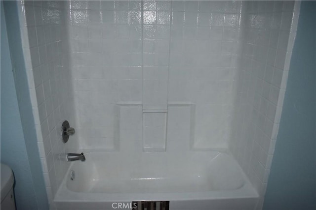 bathroom with toilet and shower / bathtub combination