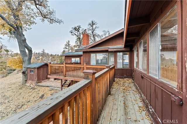 wooden deck with a shed